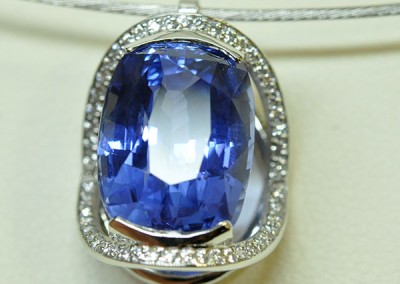 Diamond sapphire pendant mounted on a white gold necklace