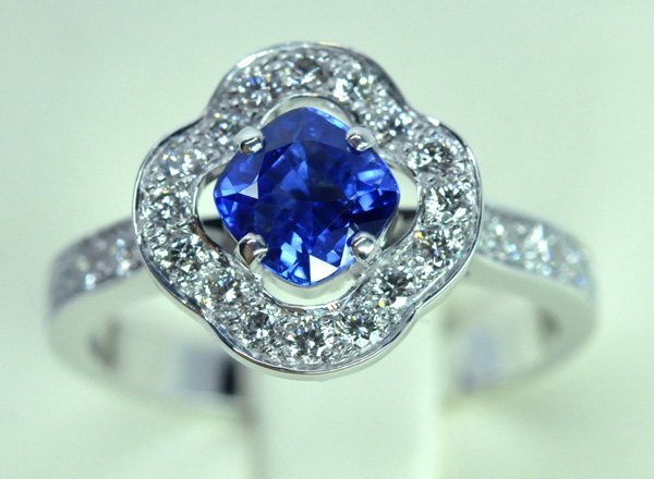 Ocean ring. Sapphire cushion. White gold diamond frame