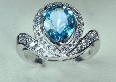 White gold ring, blue zircon diamonds