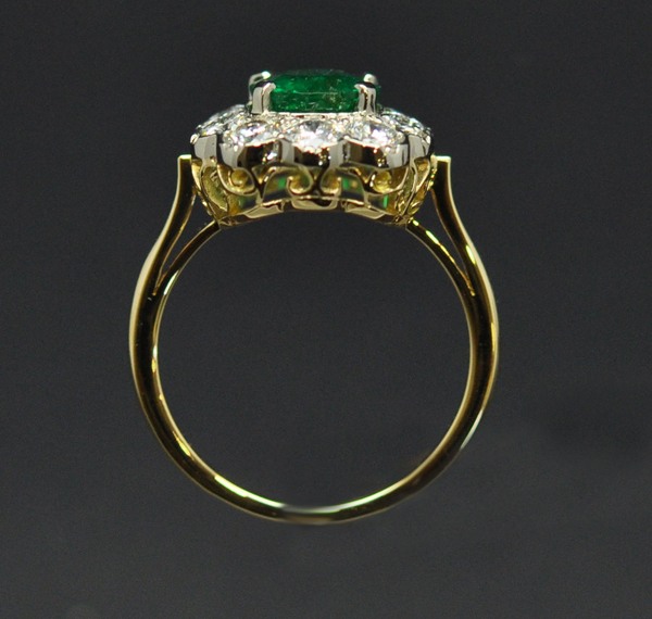 Emerald white gold and yellow gold diamond ring. Basket cut.