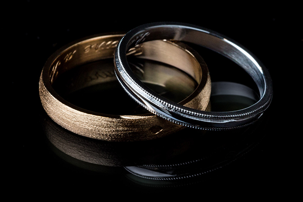 Brushed yellow gold wedding rings and palladium white gold wedding ring with outdoor beading.