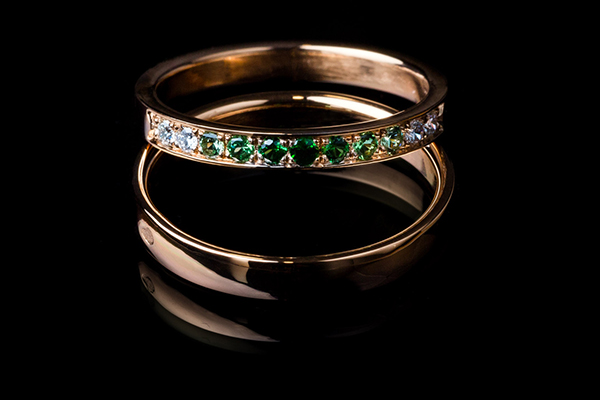 Wedding ring. Rose gold setting. Gradient of tsavorite garnets