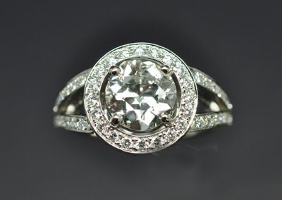 Round ring, palladium white gold setting. Half-cut center diamond (old cut).